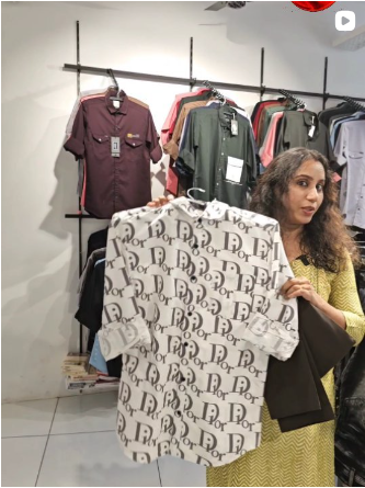 Men’s shirts displayed inside the Ishal Dresses showroom